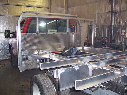 Red truck with a steel bed